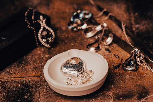 a couple of spoons sitting on top of a white plate