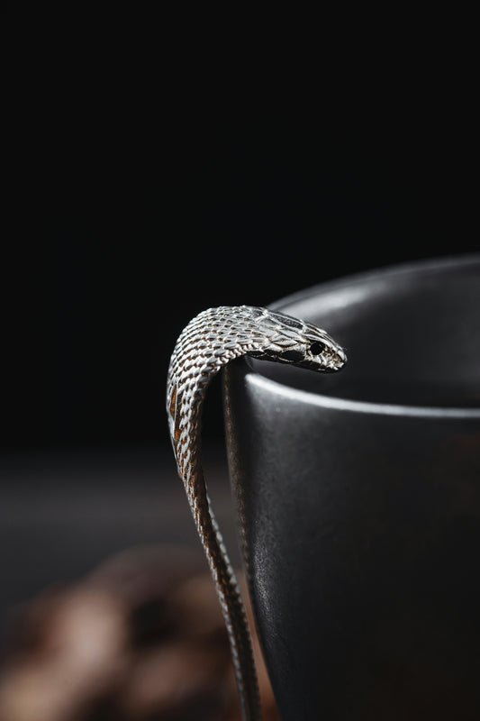 a close up of a snake in a cup