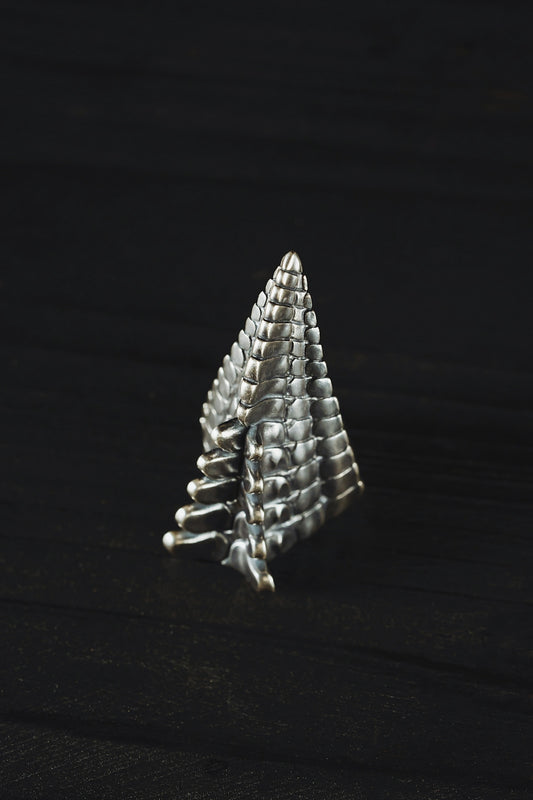 a stack of pins sitting on top of a wooden table