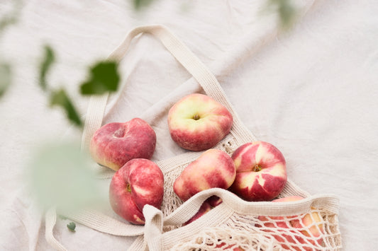 Peaches in a mesh bag are ready to enjoy.